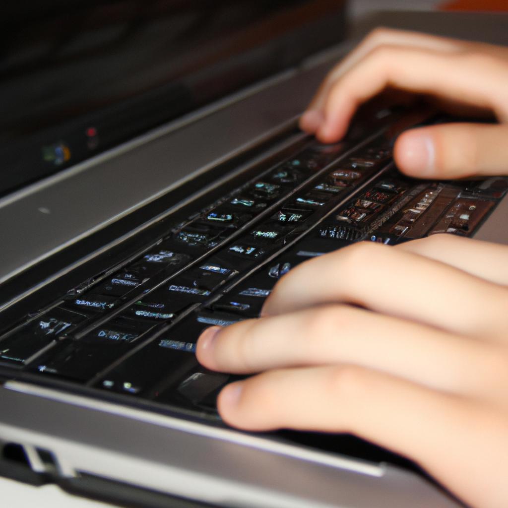 Person typing on a laptop